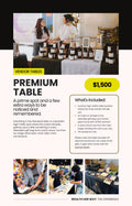 Wealth Her Way Premium vendor table, $1,500: two women talking behind a candle vendor table, with a prime high-traffic location, a gift-bag insert for 600 attendees, a stage shout-out and VIP daytime access for one.